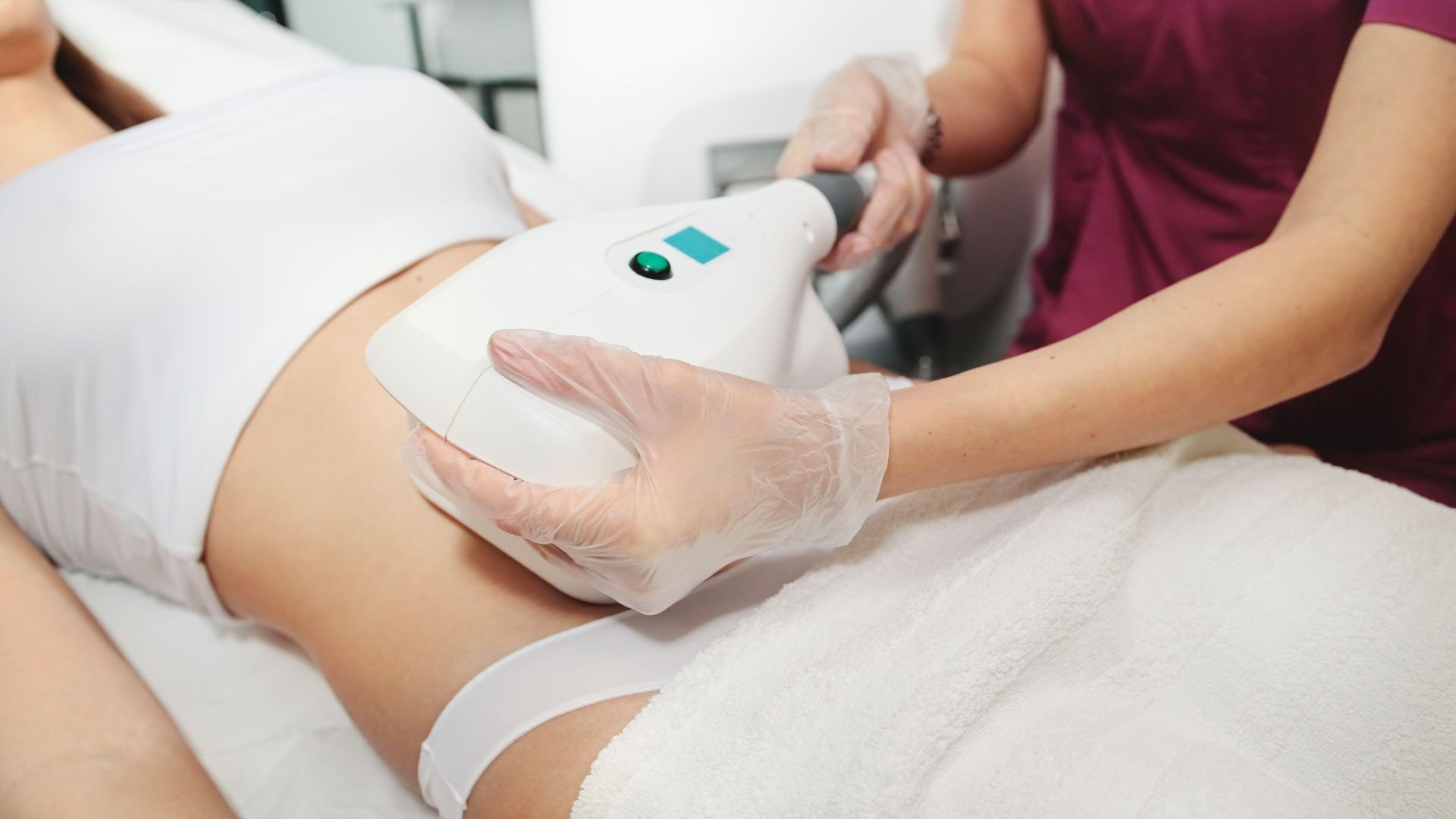 Laser hair removal treatment on abdomen with medical professional